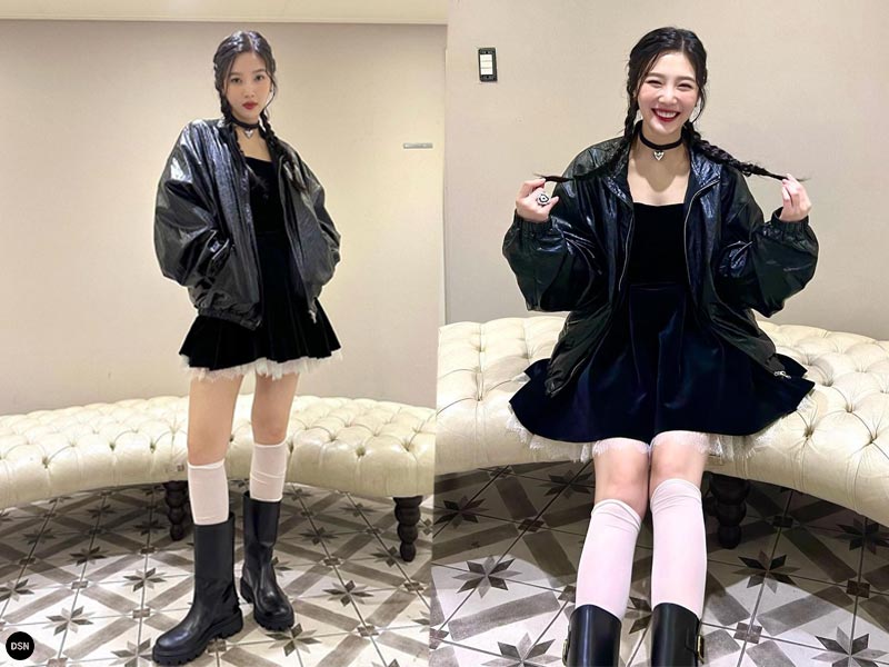 Joy wearing black long boots with impressive outfit